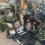 Troops of Operation Whirl Stroke intercept a criminal kingpin’s wife and seize a cache of weapons, including rifles and grenades, in Amadu Village, Taraba State.”
