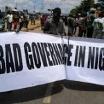 Young Nigerians protesting peacefully on a city street, symbolising youth demands for dialogue and political inclusion
