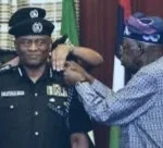 President Tinubu decorating his tribesman, Tunde Disu as acting IGP