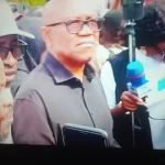 Presidential hopeful Peter Obi and pro-democracy activists protest outside Nigeria’s National Assembly, calling for a review of the Electoral Act Reform Bill.